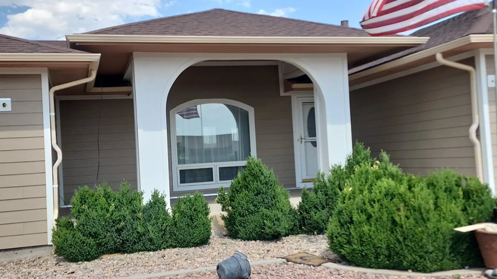 Porch and entry — Trim and columns refinished.