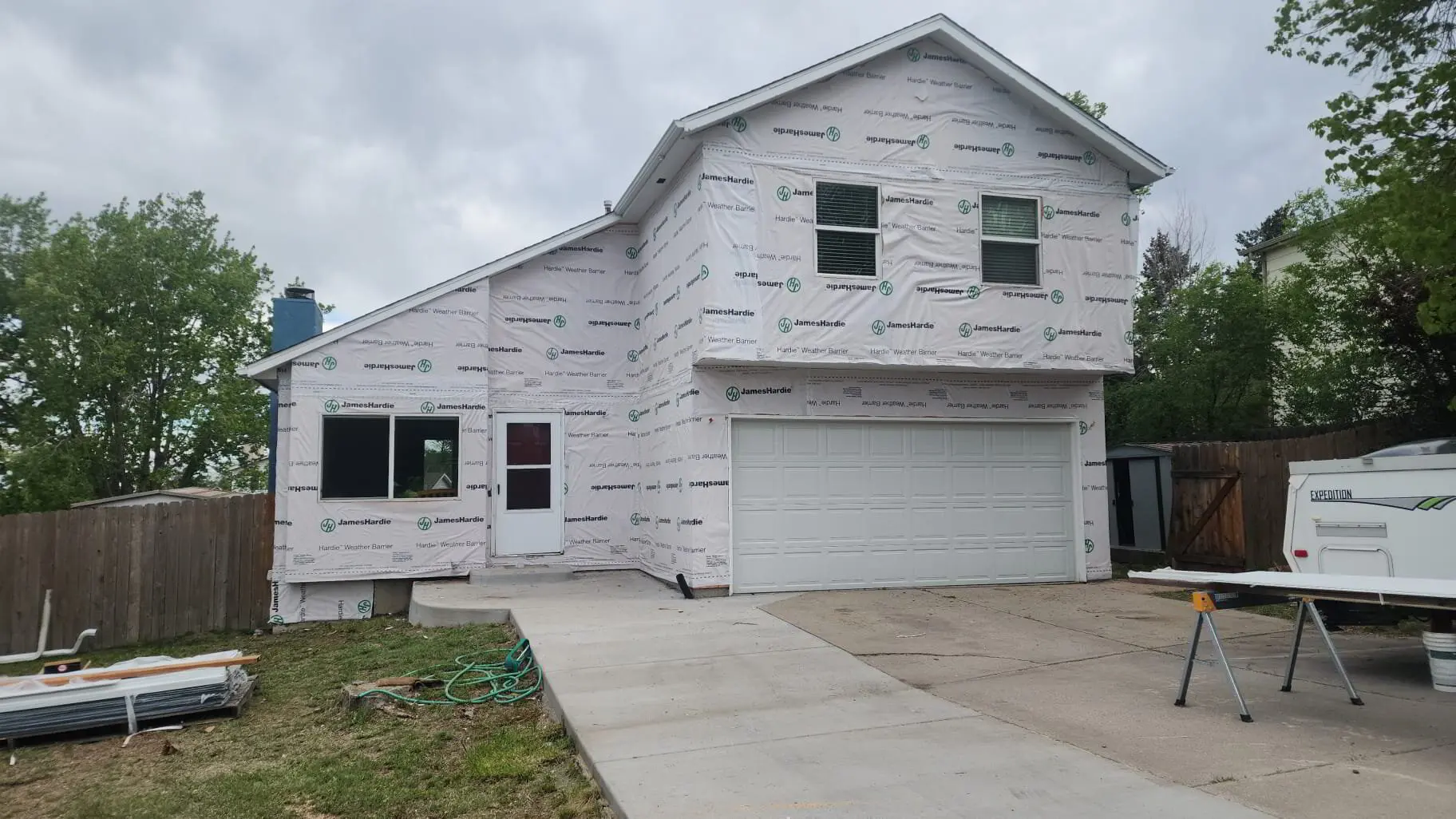 Full wrap — House wrap and window flashing, before the siding goes on.